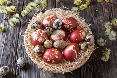 High angle view of strawberries in basket on table