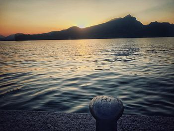 Scenic view of lake against sky during sunset