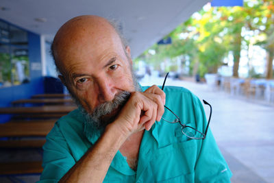 Portrait of young man smoking cigarette