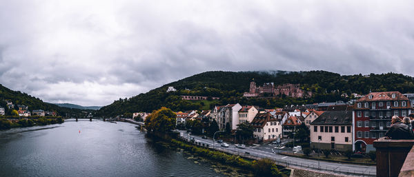 Panoramic view of buildings and mountains against sky