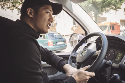 Delivery man driving truck