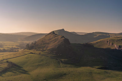 Scenic view of landscape against clear sky during sunset