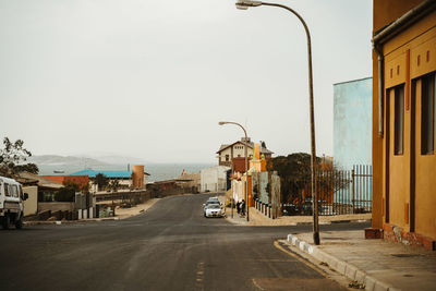 Street in city against clear sky