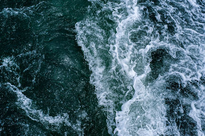 High angle view of water flowing through rocks