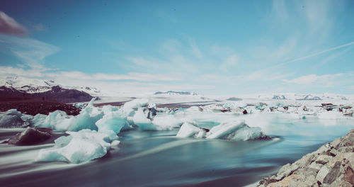 Scenic view of frozen sea against sky