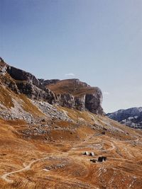 Scenic view of mountains against clear blue sky