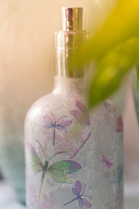 Close-up of glass bottle on table