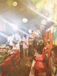 Group of people at market stall