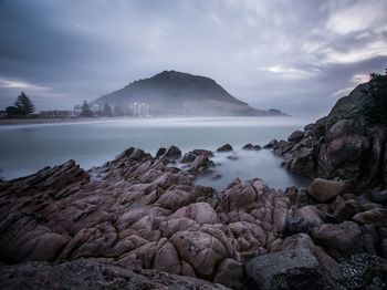 Scenic view of sea against cloudy sky