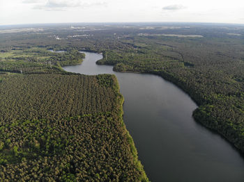 High angle view of river amidst landscape against sky