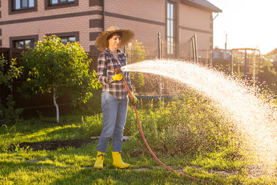 Full length of man standing in yard