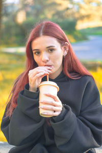 Young woman drinking coffee