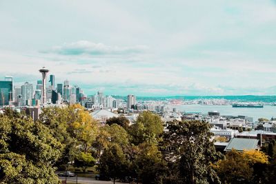 High angle view of buildings and trees against sky