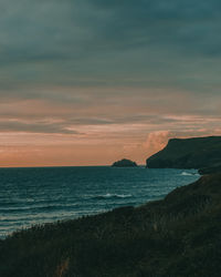 Scenic view of sea against sky at sunset