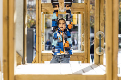 Boy standing at home