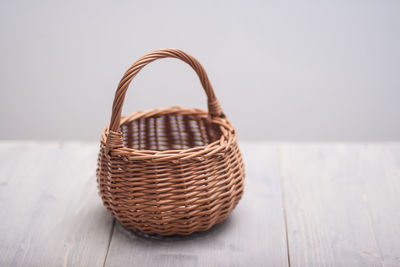 Close-up of wicker basket on table