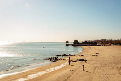 Scenic view of beach against clear sky