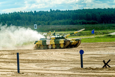 Panoramic view of machinery on field against sky