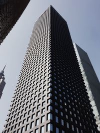 Low angle view of modern buildings against clear sky