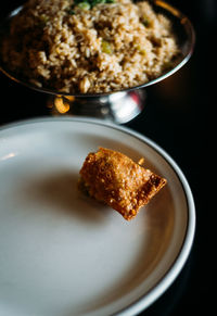 A single half eating egg roll on a plate.