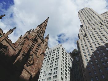 Low angle view of skyscrapers against sky