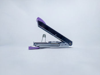 Close-up of metallic structure against white background