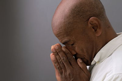 Close-up of senior man suffering from head