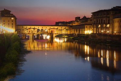 View of illuminated buildings at sunset