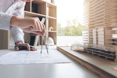 Close-up of man working on table