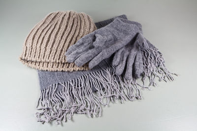 Close-up of hat on table against white background