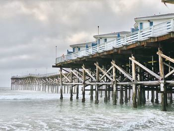 Pier over sea against sky