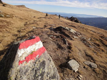 Scenic view of rocks on land against sky