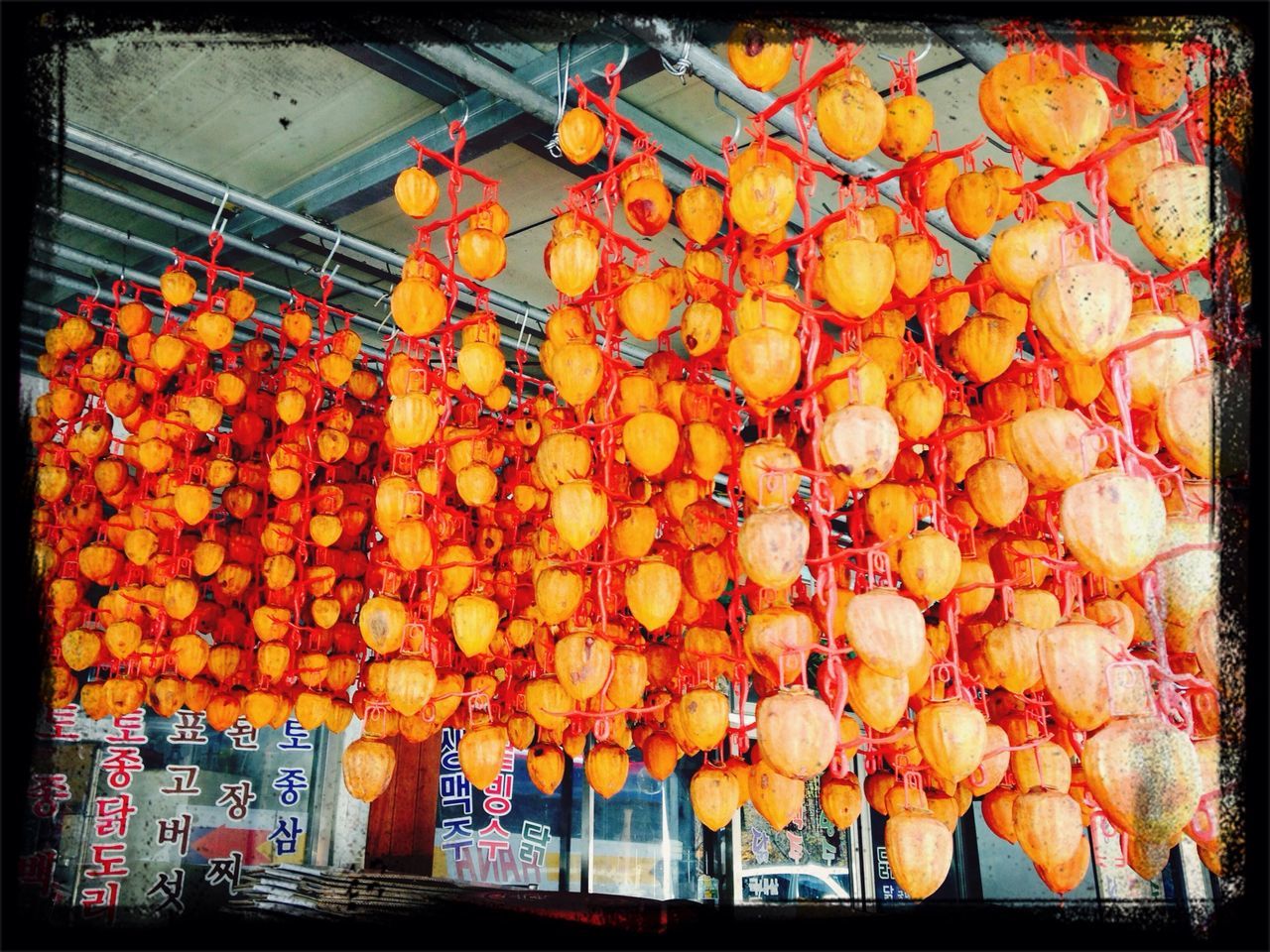 transfer print, auto post production filter, abundance, freshness, retail, large group of objects, multi colored, for sale, variation, hanging, yellow, market, built structure, market stall, orange color, architecture, fruit, flower, decoration, arrangement