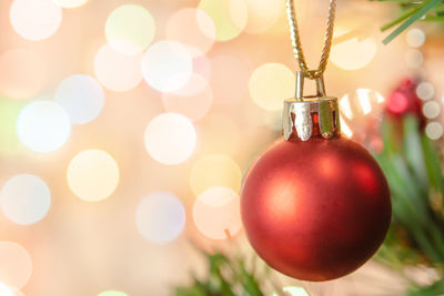 Close-up of christmas decorations hanging on tree