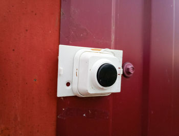 Close-up of camera on wall