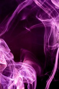 Close-up of smoke against black background