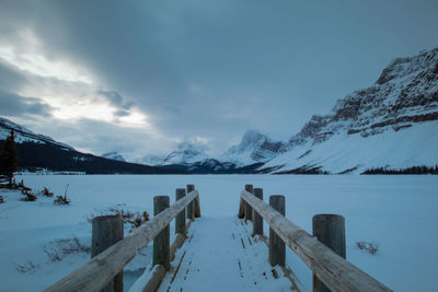 Scenic view of snowcapped mountains against sky during winter