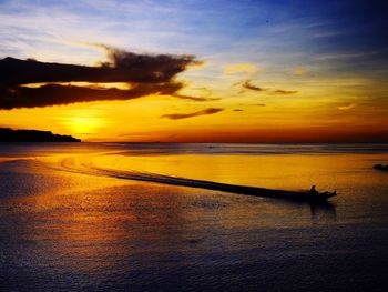 Scenic view of sea against orange sky