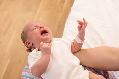 Midsection of doctor examining patient at home