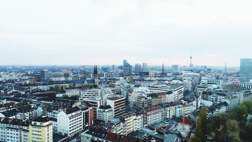 High angle view of buildings against sky in city