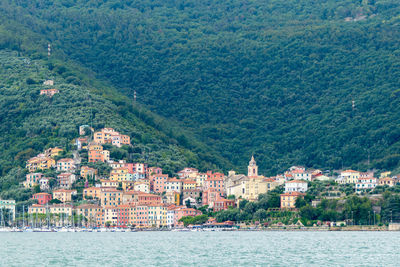 La spezia, italy, july 30, 2023. view of the village of cadimare from the sea.