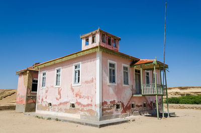 Old colonial building against clear blue sky, mucuio, angola