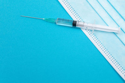 High angle view of blue container over white background