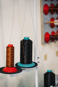 Spool of threads. colorful thread spools hanging on fabric and textile industry manufacturing