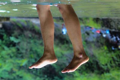 Low section of man legs in water