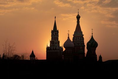 Silhouette of temple building against sky during sunset