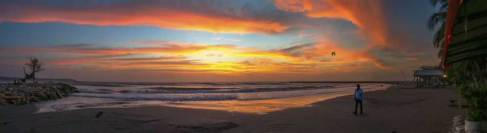 Scenic view of beach against sky during sunset