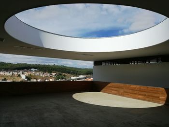 Buildings against cloudy sky