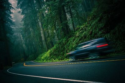 Blurred motion of car on mountain road