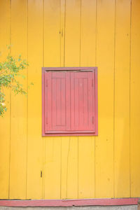 Closed door of yellow building